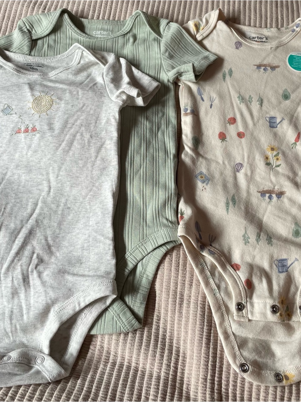 Carter's Short-Sleeve Baby One-piece bodysuit in a Three Piece set.